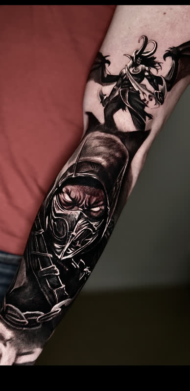 Scorpion forearm piece with winged figures in black and grey