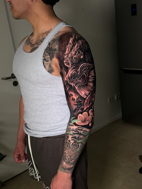 Dragon full sleeve extending onto the chest